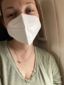 photo of me in a mask on the airplane